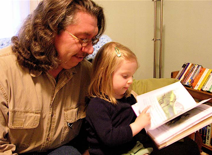 Eva reads a book to Jimmy. ©Susan Shie 2007.
